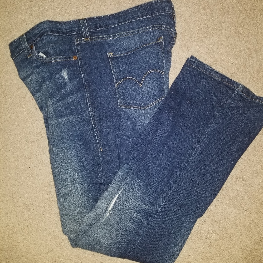 Distressed Levi's mid-rise boot cut